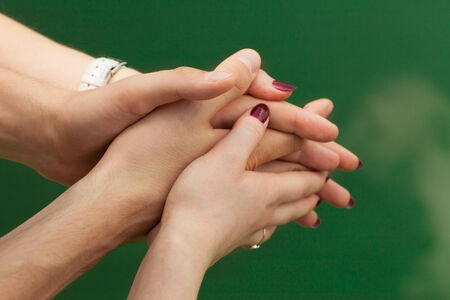 Female hands softly hugs male hands with love