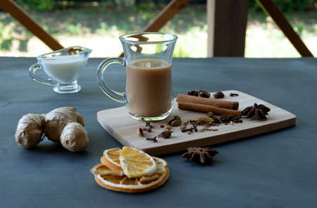 Traditional Indian masala tea with spices. Anise, star anise, cinnamon, pepper, milk.