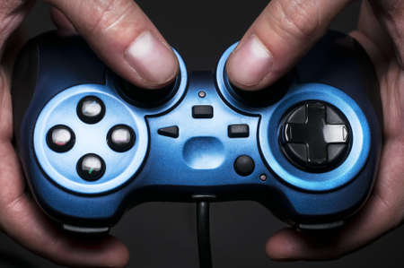 Somebody holding a gamepadの写真素材