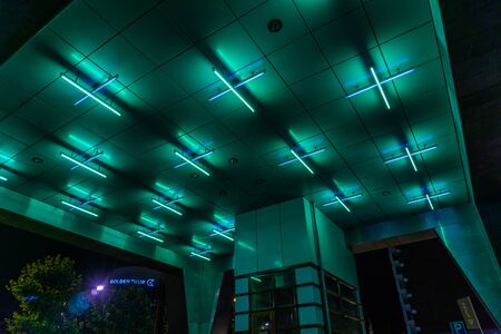 Turquoise glow underneath a buildingの写真素材