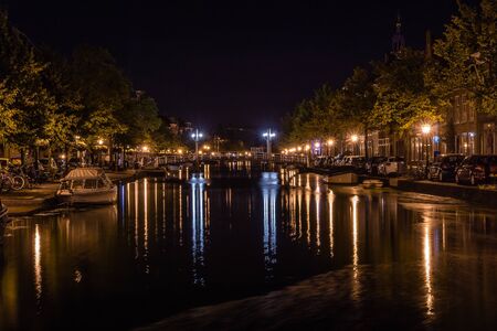 Dutch city center with blurred reflections in waterの写真素材