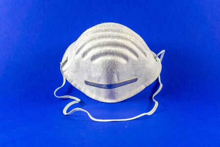 Protective mouth mask on a blue background