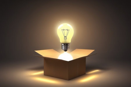 Light bulb coming out of a cardboard box.の素材