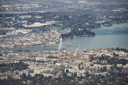 Aerial view of Geneva (Switzerland) with its famous water spring, city center, buildings and ngos taken with a telephoto lens (200mm)の写真素材