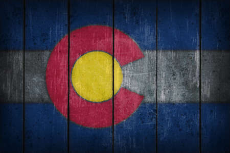 colorado flag on old wooden woundの写真素材