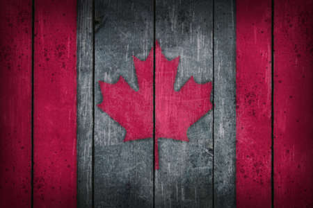 canada flag painted on old wooden backgroundの写真素材