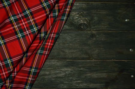 tartan textile on wooden backgroundの写真素材