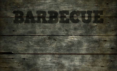 barbecue tag on old wooden board backgroundの写真素材