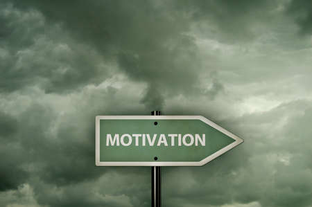 sign with motivation tag in front of dark cloudy sky - 3d renderingの写真素材