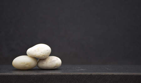 Setting pyramid stone on table with copy spaceの写真素材