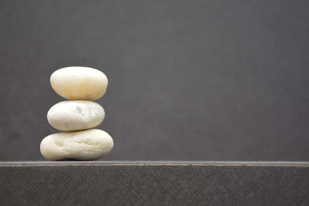 Balanced stones on table with copy space and blur backgroundの写真素材