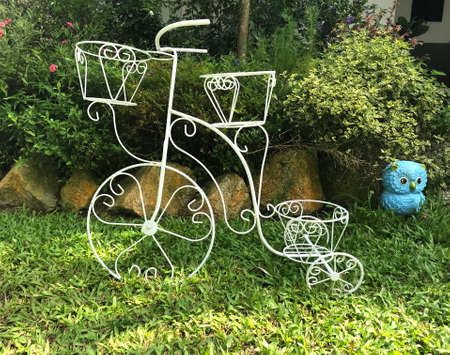 beautiful decorate curved steel bike on garden backgroundの写真素材