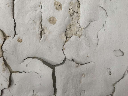 peeling painted like human face on wall background