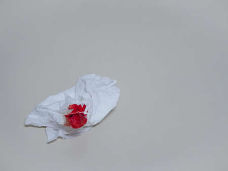 close up detail of texture blood on tissue paper (nosebleed) with white background by air pollution , n 95 , pm 2.5の写真素材