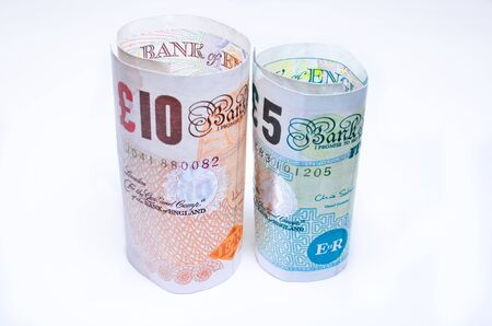 British banknotes pounds sterling rolled UK England