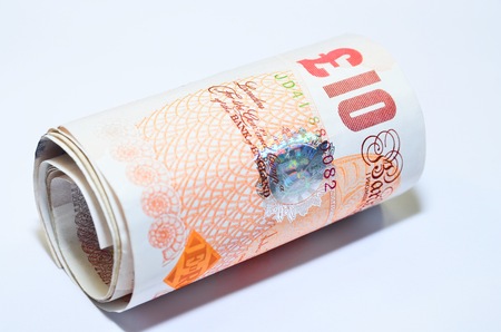 British banknotes pounds sterling rolled UK Englandの写真素材