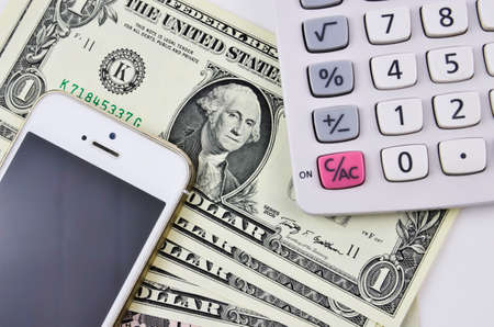 shows that using of mobile phone is costly shows calculatorの写真素材
