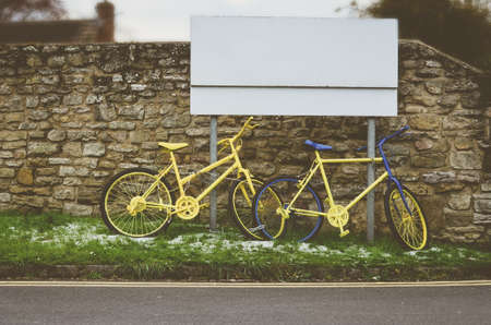Old retro bike painted with yellow color. Vintage effect.の写真素材