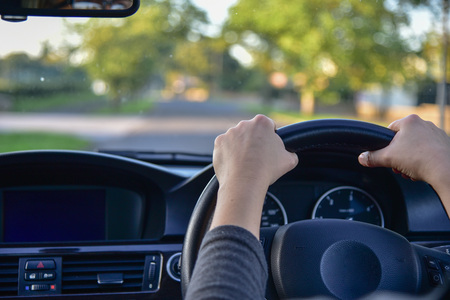 A woman driving a modern car.の写真素材