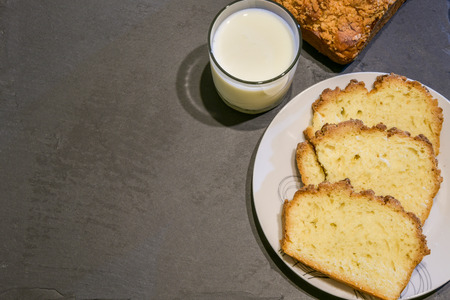 Yeast cake with crumble and glass of milk.の写真素材