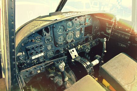 Old military plane cockpit control with use of photo effects