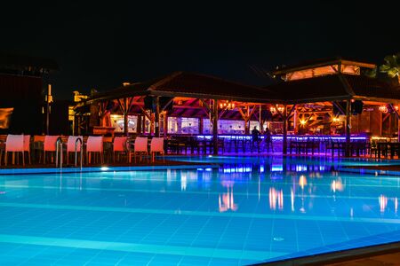 Night view of beautiful swimming pool in tropical resort in Oludeniz Turkeyの写真素材
