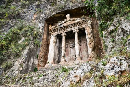 Lycian rock cut tombs at Dalyan, Turkey, were built BC. They were built in stones, at the cost of Dalyan Bogazi river.の写真素材