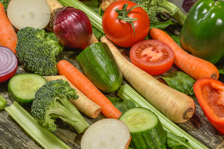 Colorful fresh group of vegetables for a balanced diet. Wooden background.の写真素材