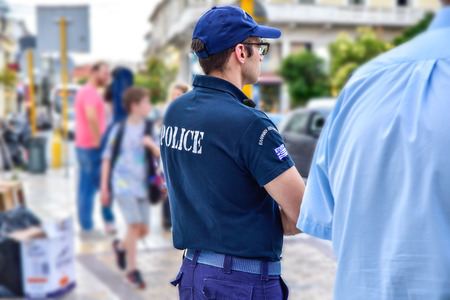 Chania , Greece - June 14, 2018 : Greece policeman working for street safety during local picket,...