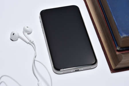 A set of books being played as audio through the headphone speakers