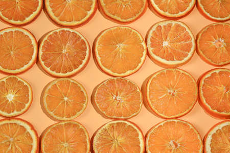 Abstract background with citrus-fruit of orange slices. Close-up. Studio photography.の写真素材