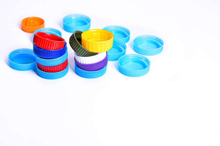Big colored bottle plastic cap zero waste recycling on white backgroundの写真素材