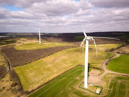 Broken windmill shovels. Damaged windmill for generating electricity. Season of the spring