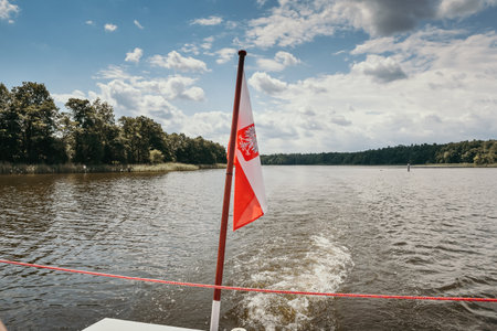 Polish flag on a boat on Lake Jeziorak in Polandの写真素材