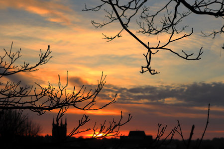 Winter sunrise sky over a townの写真素材