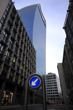 London's financial district commercial skyscraper with road sign in foregroundの写真素材