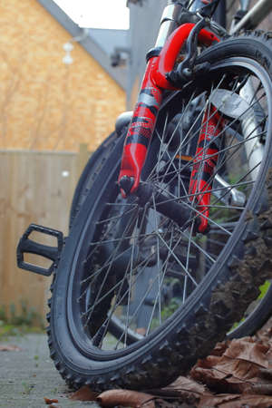 Bicycle wheel with red shock absorbersの写真素材