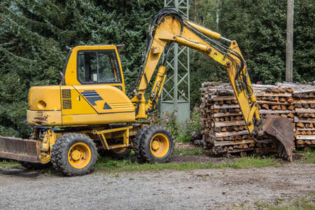 yellow excavator on construction siteの写真素材