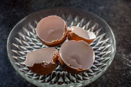 broken breakfast egg on tableの写真素材