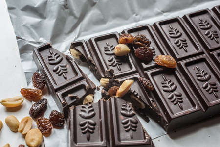Chocolate bar with nuts and grapes
