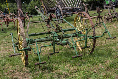 Historic agricultural machinery on the fieldの写真素材