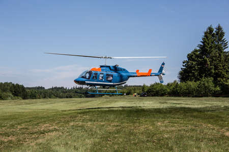 Sports airfield with runway and Helicopter on lawn in Wendenの写真素材