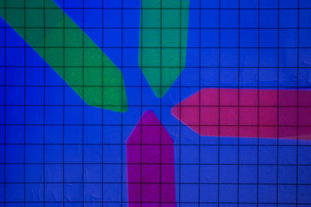 Arrows with fluorescent paint in UV lightの写真素材