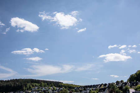 Cloud formations in the blue summer skyの写真素材