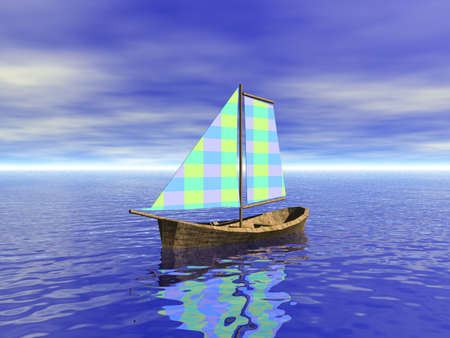 small sailboat with inflated sails floating on the waterの写真素材