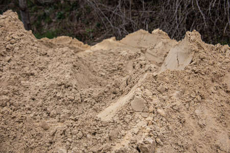 Pile of gravel at the roadside for road constructionの写真素材