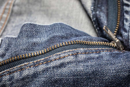 metallic zipper on blue jeansの写真素材