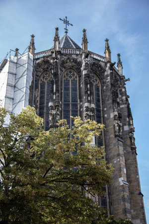 Aachen Cathedral with pointed towers and decorations under the blue skyの写真素材