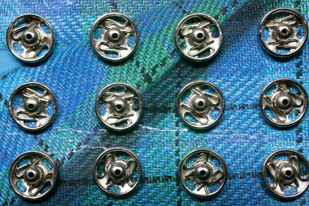 a large number of buttons for clothes in a heap