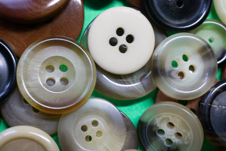 a large number of buttons for clothes in a heapの写真素材